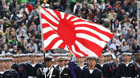 The flag of the Japan Maritime Self-Defense Force is seen in a military review at the Ground Self-Defence Force Asaka training ground in Asaka, Saitama prefecture on October 14, 2018. 