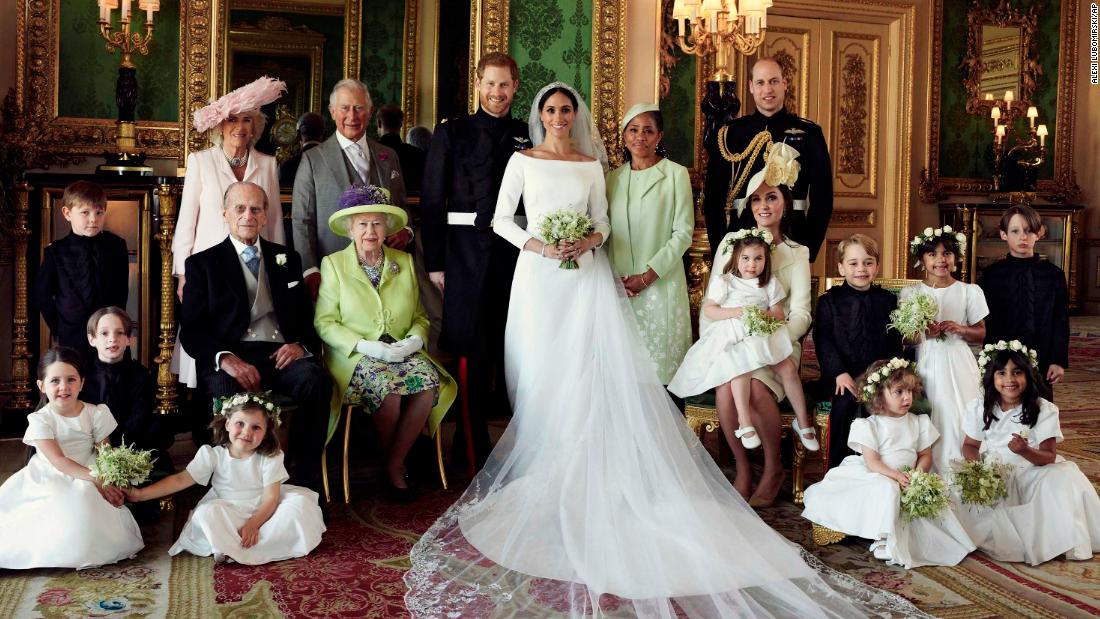 The couple poses with family members after getting married in May 2018.