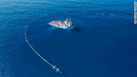 This floating pipe is trying to clean up all the plastic in the ocean