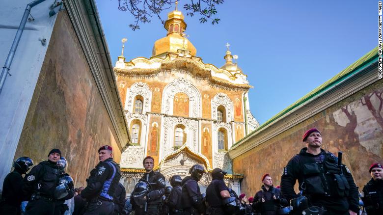 Policemen stand guard in front of the central entrance of the Kiev Pechersk Lavra monastery on October 11.