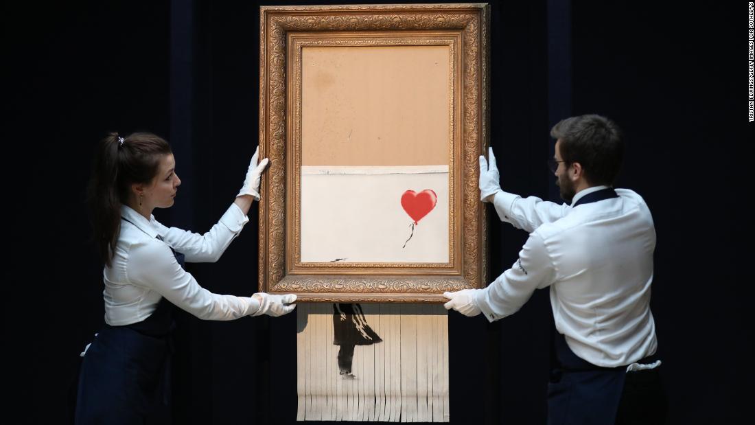 A look at some of the recent work of the famously anonymous British graffiti artist Banksy. Banksy's &quot;Love is in the Bin&quot; is unveiled on October 12, 2018, at Sotheby's in London. Originally titled &quot;Girl with Balloon,&quot; the canvas passed through a hidden shredder seconds after the hammer fell on October 5 at Sotheby's London Contemporary Art Evening Sale, making it the first artwork in history to have been created live during an auction.