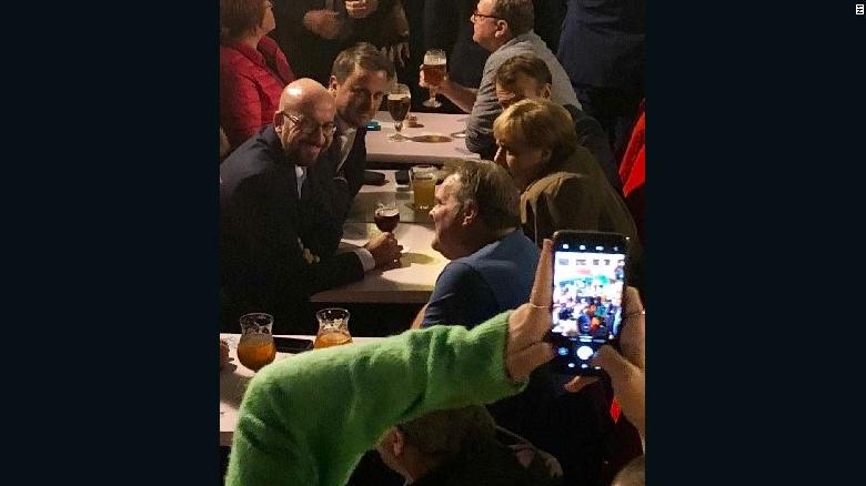 From left to right, Belgian Prime Minister Charles Michel, Luxembourg PM Xavier Bettel, French President Emmanuel Macron and German Chancellor Angela Merkel enjoy a beer in Brussels on October 17.