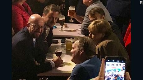 From left to right, Belgian Prime Minister Charles Michel, Luxembourg PM Xavier Bettel, French President Emmanuel Macron and German Chancellor Angela Merkel enjoy a beer in Brussels on October 17.
