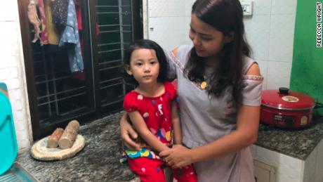 Chit Su Win, wife of Kyaw Soe Oo, with their 3-year-old daughter Moe Thin Wai Zan. They just moved to Yangon from Sittwe to be closer to the jail.