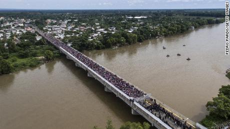 An aerial view shows the migrant caravan waiting on the Guatemala-Mexico international bridge in Ciudad Hidalgo, Chiapas state, Mexico.