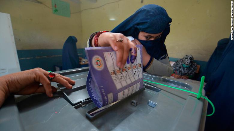 A woman casts her vote at a polling station in Jalalabad, the capital of Afghanistan's eastern Nangarhar province.