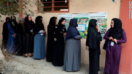 Afghan women line up to cast their votes Saturday outside a polling station in Kabul.