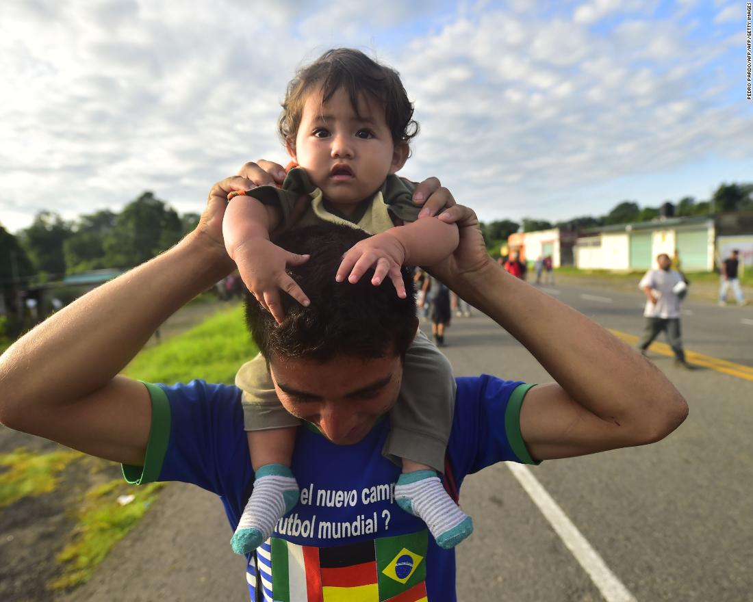 Honduran migrants, part of a caravan heading toward the United States, travel on the road linking Ciudad Hidalgo and Tapachula, Chiapas state, Mexico, on Sunday.