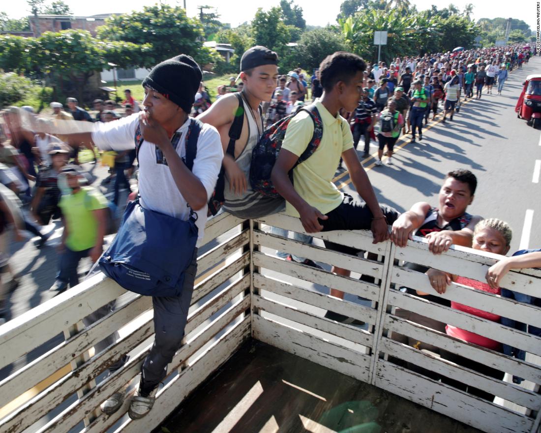 Central American migrants hitchhike along the highway near the border with Guatemala, as they continue their journey trying to reach the United States.