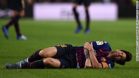 Lionel Messi landed heavily on his right arm after colliding with an opponent. 