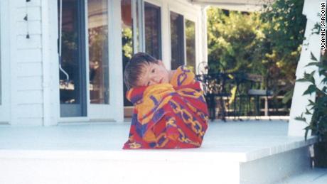 John Sarcona as a young boy, before his severe scoliosis developed.