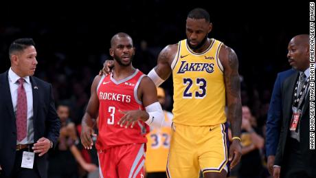 LeBron James escorts Chris Paul of the Houston Rockets after an on-court fight.