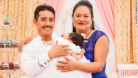 The patient with her partner and daughter at the baby girl's baptism.