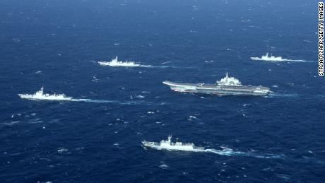 This aerial photo taken on January 2, 2017 shows a Chinese navy formation, including the aircraft carrier Liaoning (C), during military drills in the South China Sea.