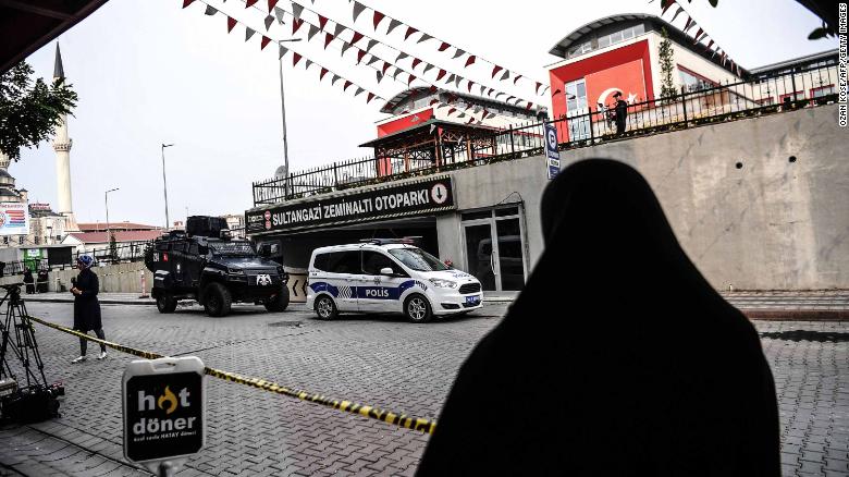 Turkish police stand guard in front of parking lot in Istanbul, where an abandoned car belonging to the Saudi consulate was found.
