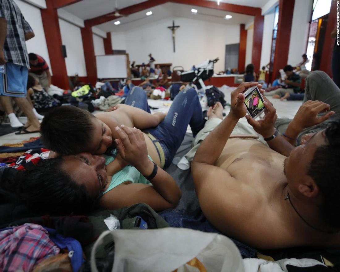 Migrants rest in the town of Huixtla, Mexico.