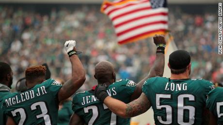 When Malcolm Jenkins raised his fist,  teammate Chris Long offered a public sign of support.