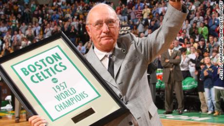 Bob Cousy receives a  banner marking the 50th anniversary of the 1957 championship.