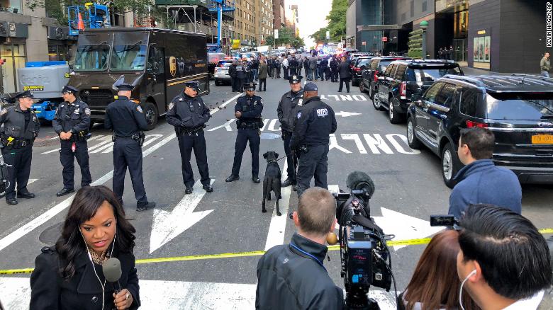 New York Police stand outside the Time Warner Center at Columbus Circle, Wednesday, Oct. 24, 2018 in New York. A police bomb squad was sent to CNN&#39;s offices at the center, and the newsroom was evacuated because of a suspicious package. (AP Photo/Kevin Hagen)