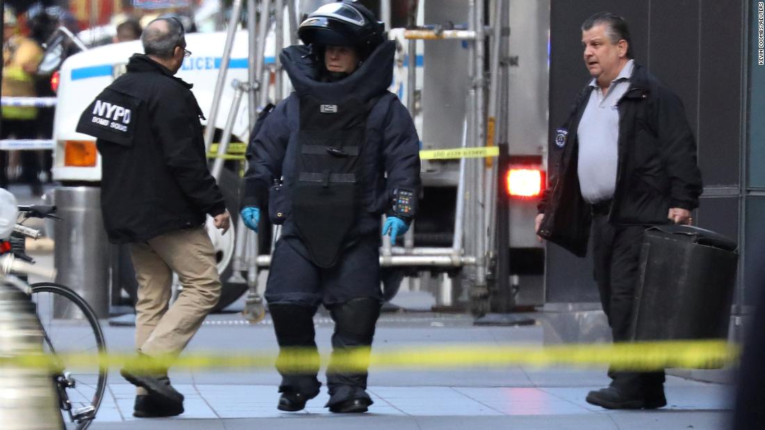 A member of the New York Police Department bomb squad is pictured outside the Time Warner Center in New York on Wednesday after a suspicious package was found inside.