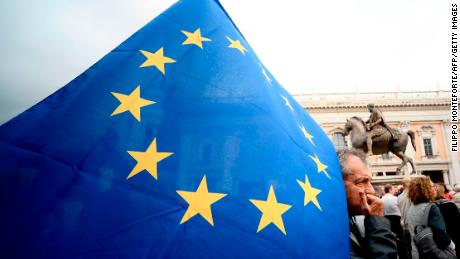 A demonstrator holds an EU flag in Rome&#39;s Piazza del Campidoglio  during a protest Saturday against decay of the capital under the populist Five Star Movement.