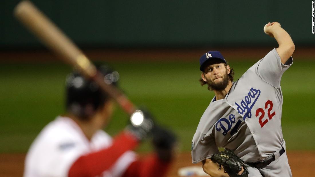 Clayton Kershaw of the Los Angeles Dodgers delivers a pitch during the first inning against the Boston Red Sox in Game 1. Kershaw was given the loss after giving up five runs over four innings pitched.
