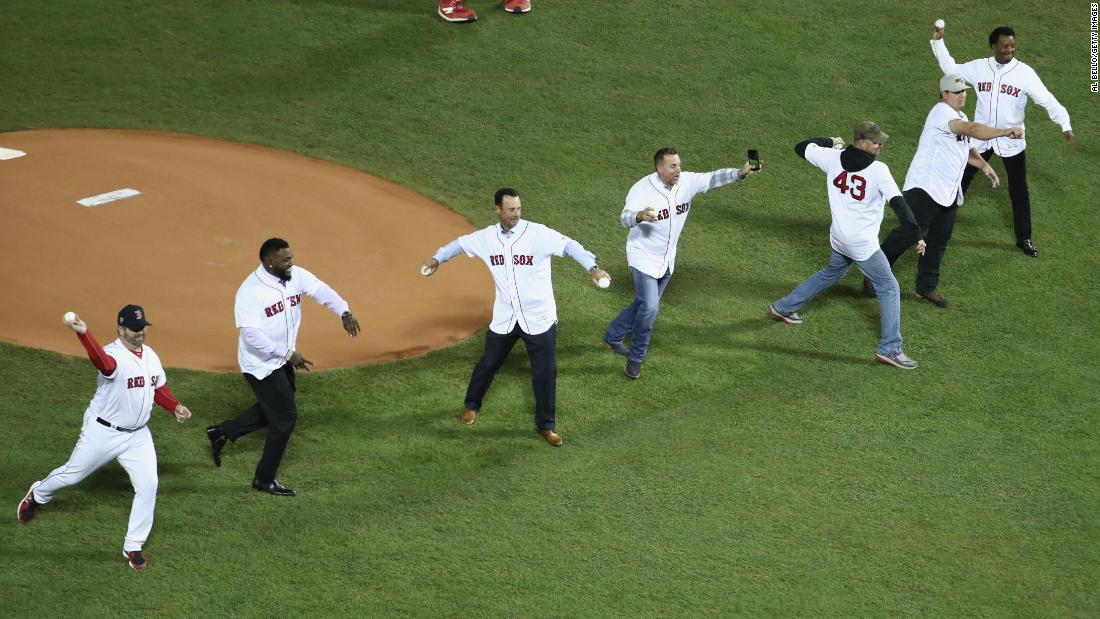 Members of the 2004 World Series Champion Boston Red Sox throw out the ceremonial first pitch before Game 2.