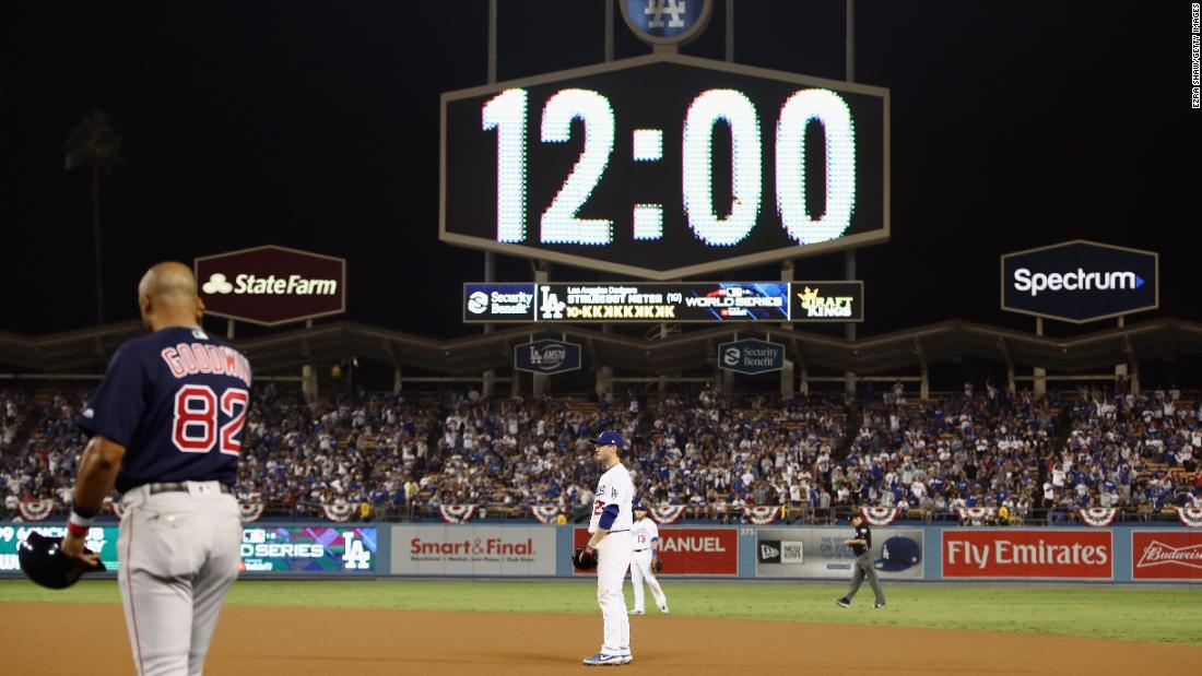 The scoreboard shows 12 a.m. as Game 3 enters the 17th inning at Dodger Stadium. The game ended one inning later on a walk-off home run by Dodgers&#39; infielder Max Muncy.
