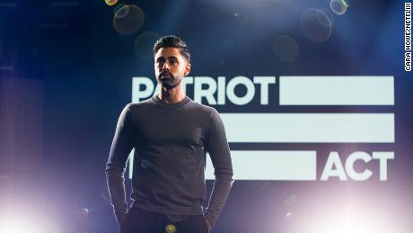 Minhaj poses on the set of his Netflix show, &quot;Patriot Act.&quot;