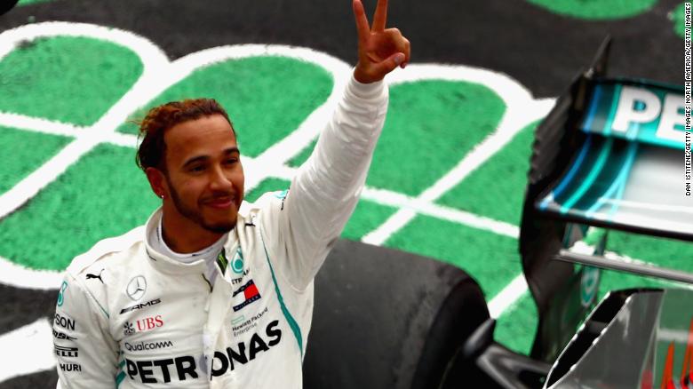 Lewis Hamilton savors the moment after clinching his fifth F1 world title with fourth place behind Max Verstappen in the Mexican Grand Prix. 