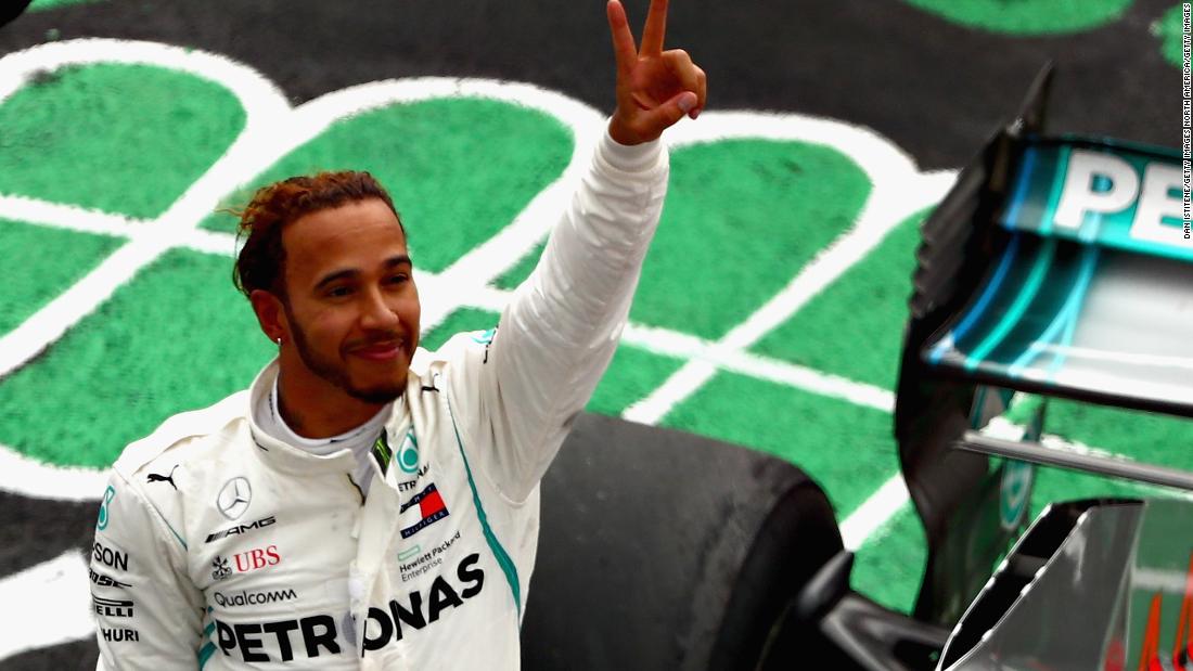 Lewis Hamilton savors the moment after clinching his fifth F1 world title with fourth place behind Max Verstappen in the Mexican Grand Prix. 