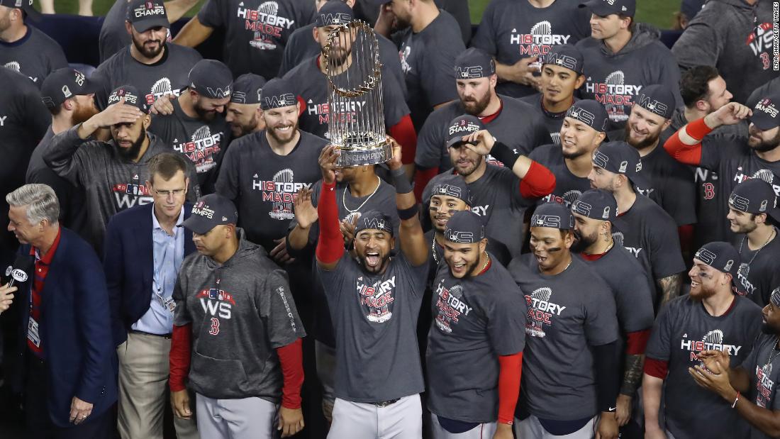 The Boston Red Sox celebrate with the World Series trophy after their Game 5 win over the Los Angeles Dodgers.
