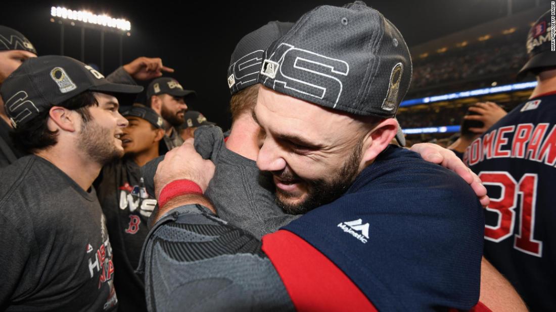 World Series MVP Steve Pearce celebrates with a teammate.