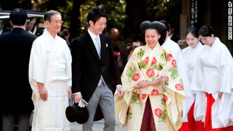 Japanese Princess Ayako, dressed in traditional ceremonial gown, and Japanese businessman Kei Moriya, arrive at Meiji Shrine for their wedding ceremony in Tokyo, Oct. 29, 2018.