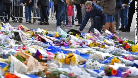 Flowers are piled up outside the King Power Stadium in Leicester following the death of the club's owner in a helicopter crash. 