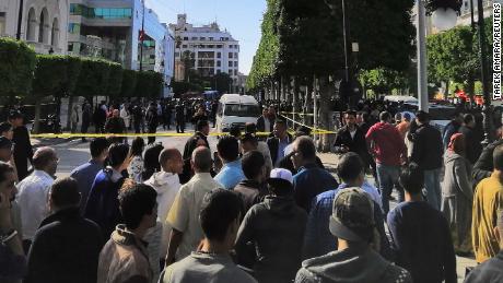 Crowds gather near the site of an explosion in the center of Tunis.