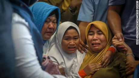 Families grieve at airport after plane crash