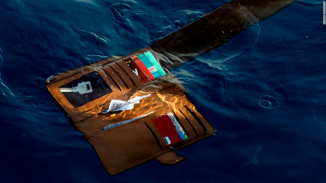 A wallet is seen in the water where the plane went down.