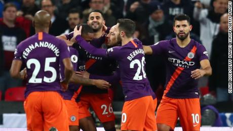 Manchester City celebrate after Mahrez's goal.