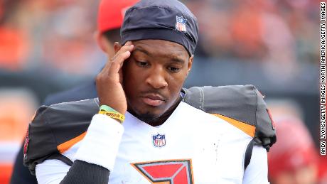 Buccaneers quarterback Jameis Winston stands in the bench area after being replaced by Ryan Fitzpatrick against the Bengals.