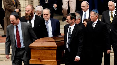 A casket is carried out of Rodef Shalom Congregation after funeral services for brothers Cecil and David Rosenthal on Tuesday in Pittsburgh.