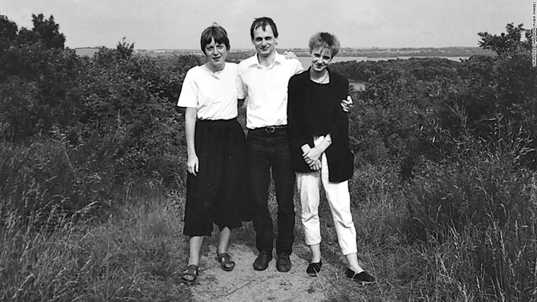Merkel poses with her siblings, Marcus and Irene Kasner.