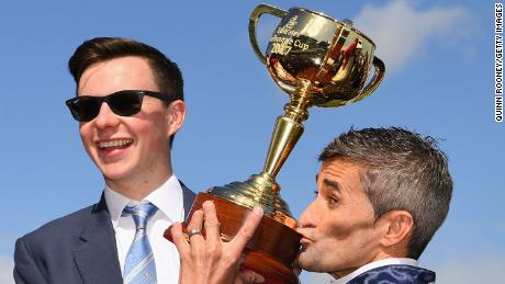 Rekindling's trainer Joseph O'Brien (left) and jockey Corey Brown with the Melbourne Cup.