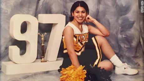 Alma Faz in her cheerleading uniform in 1997. 