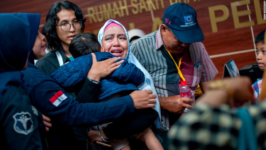 A relative of a passenger cries at a Jakarta hospital on Tuesday, October 30. Family members have been providing authorities with DNA samples to help identify victims of the crash.