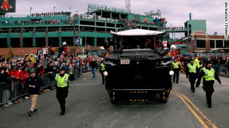 The Red Sox's victory parade rolls out from Fenway Park.