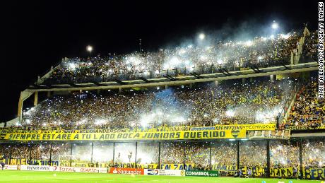 Supporters of Boca Juniors cheer for their team before their Copa Sudamericana semifinal football match against River Plate at La Bombonera stadium in Buenos Aires, Argentina, on November 20, 2014. AFP PHOTO / Maxi Failla        (Photo credit should read Maxi Failla/AFP/Getty Images)