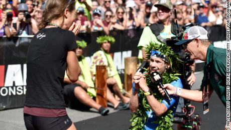 The German proposed to his girlfriend, Julia, at the finish line. 