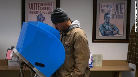 An early voter casts his vote in Athens, Georgia, October 26, 2018.