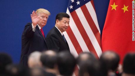 TOPSHOT - US President Donald Trump (L) and China&#39;s President Xi Jinping leave a business leaders event at the Great Hall of the People in Beijing on November 9, 2017.
Donald Trump urged Chinese leader Xi Jinping to work &quot;hard&quot; and act fast to help resolve the North Korean nuclear crisis, during their meeting in Beijing on November 9, warning that &quot;time is quickly running out&quot;. / AFP PHOTO / Nicolas ASFOURI        (Photo credit should read NICOLAS ASFOURI/AFP/Getty Images)